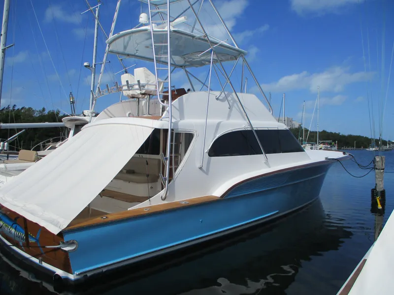 Slide: The Image of 2008 Custom Carolina 53 Sculley yacht docked in a marina. - 4