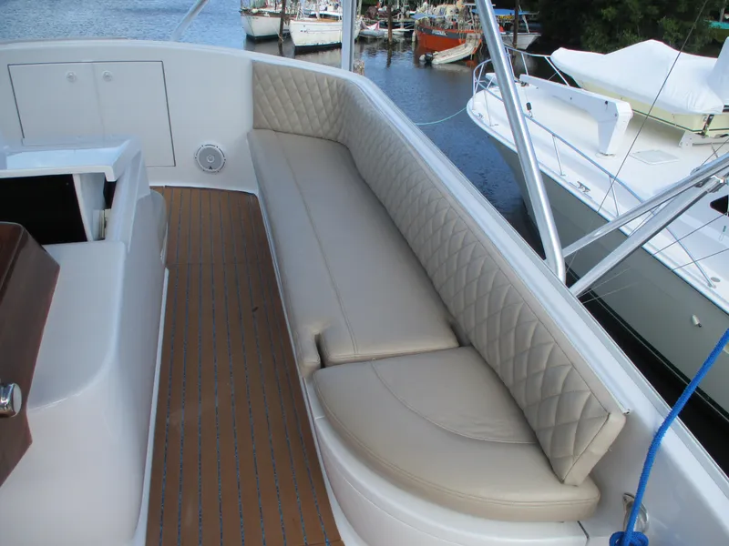 Slide: The Image of Custom Carolina 53 Sculley 2008 boat with cushioned seating and teak deck. - 46