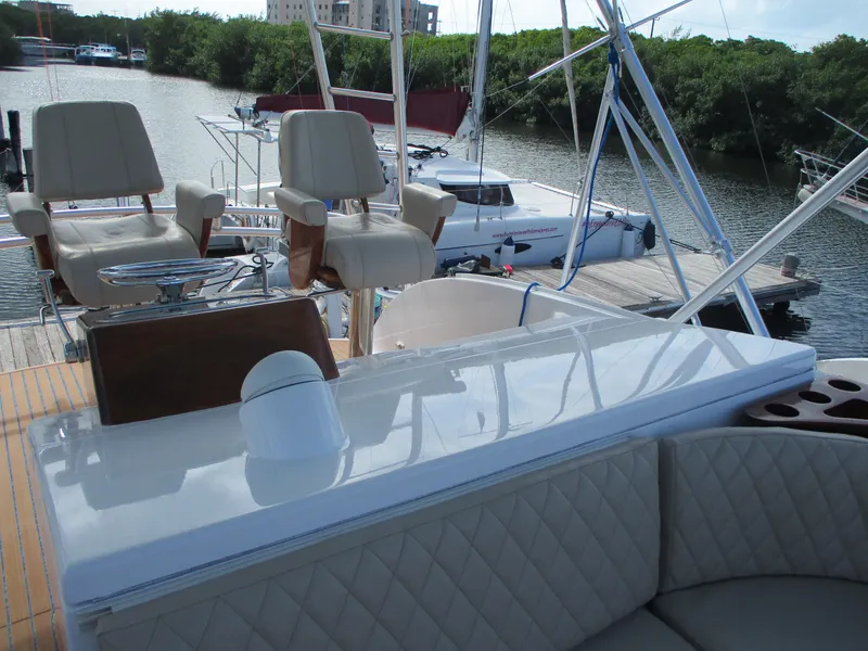 Slide: The Image of 2008 Custom Carolina 53 Sculley yacht interior with seating and helm chairs at dock. - 47