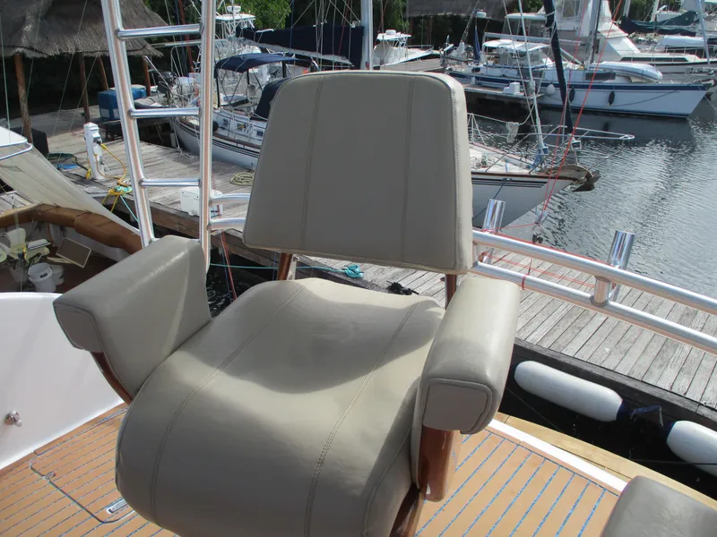 Slide: The Image of Captain's chair on a 2008 Custom Carolina 53 Sculley yacht at a marina. - 49