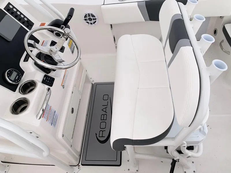 Slide: The Image of 2024 Robalo R200 Center Console boat interior with steering wheel and seating. - 3