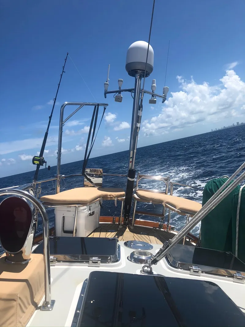 Slide: The Image of 1989 Little Harbor 54 sailboat deck with ocean view under clear blue sky. - 11