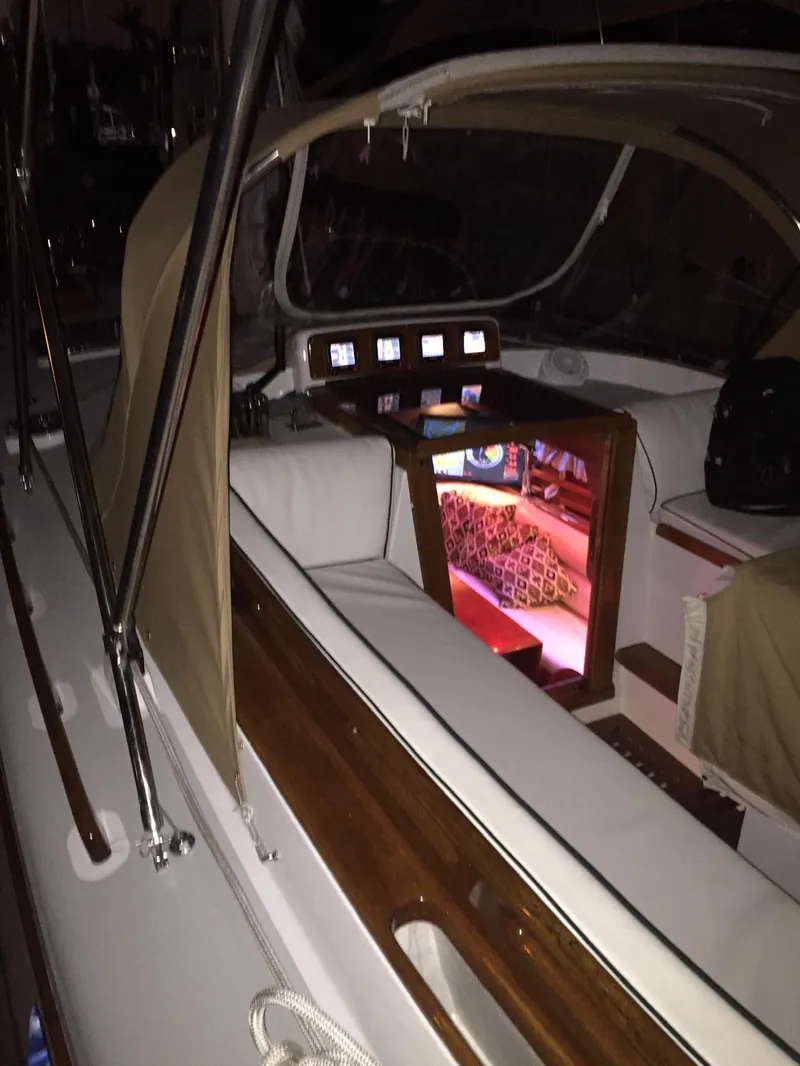 Slide: The Image of 1989 Little Harbor 54 sailboat cockpit with illuminated cabin interior. - 15
