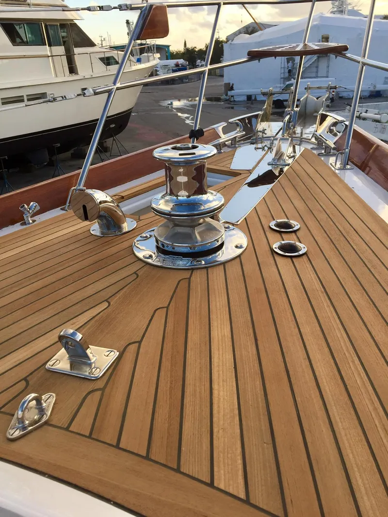 Slide: The Image of 1989 Little Harbor 54 yacht deck with polished winch and teak finish. - 16