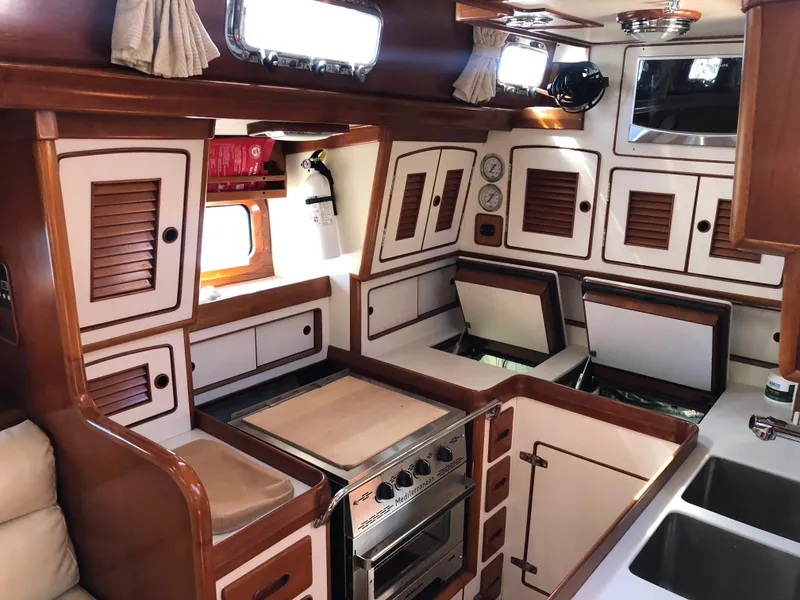 Slide: The Image of Interior of 1989 Little Harbor 54 yacht with wooden cabinetry and modern kitchen amenities. - 24