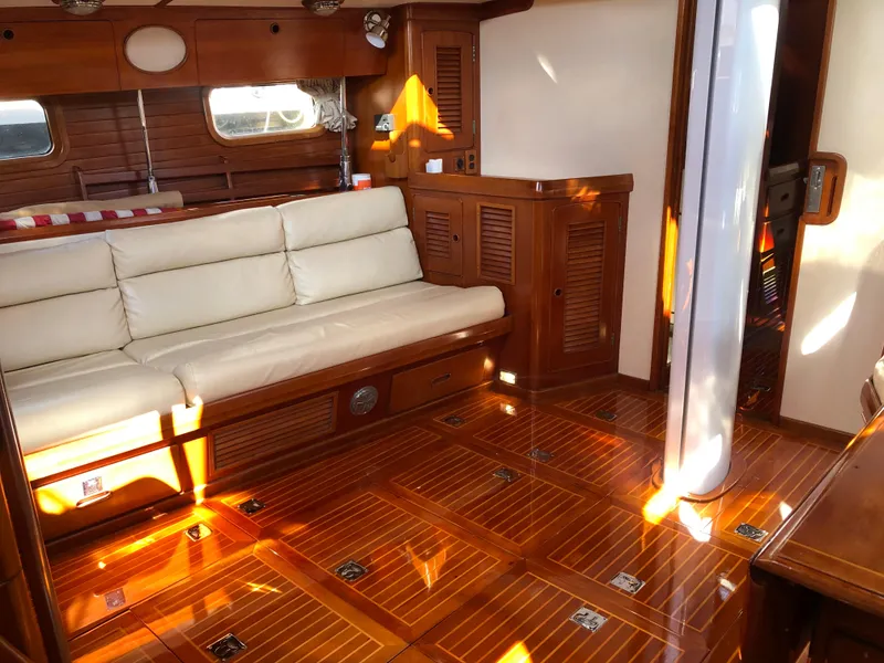 Slide: The Image of Luxurious 1989 Little Harbor 54 yacht interior with wooden flooring and cream sofa. - 27