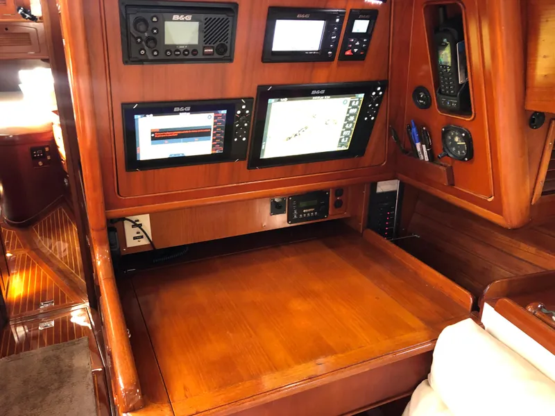 Slide: The Image of Navigation station on 1989 Little Harbor 54 yacht with electronic displays and wooden finish. - 29