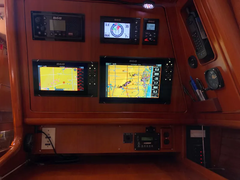 Slide: The Image of Navigation equipment on 1989 Little Harbor 54 yacht, featuring multiple electronic displays and controls. - 31
