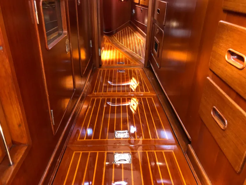 Slide: The Image of Luxurious wooden interior of a 1989 Little Harbor 54 yacht, featuring polished floors and cabinetry. - 34