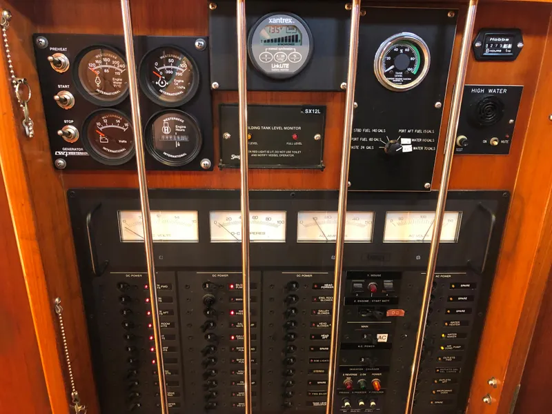 Slide: The Image of Control panel of a 1989 Little Harbor 54 yacht with gauges and switches. - 35