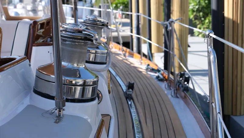Slide: The Image of Deck view of 1989 Little Harbor 54 yacht with polished winches and wooden railings. - 49