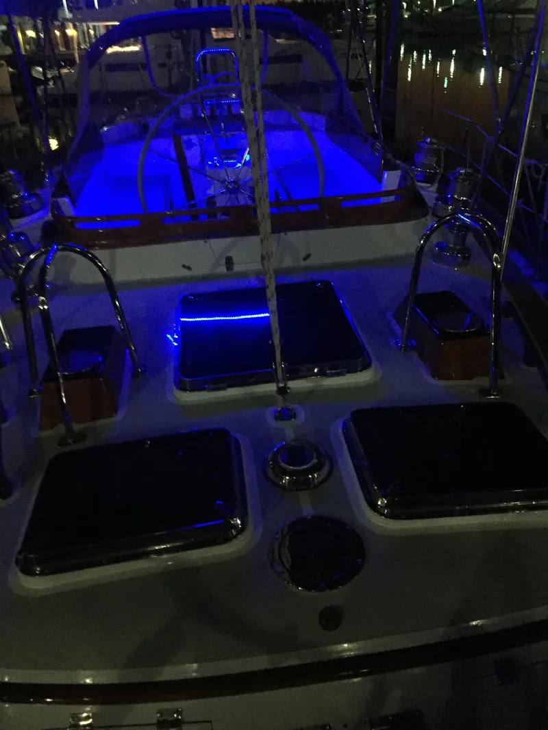 Slide: The Image of 1989 Little Harbor 54 yacht deck illuminated with blue lights at night. - 7