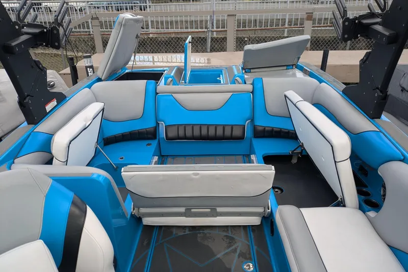 Slide: The Image of 2022 MB F22 Alpha boat interior with blue and gray seating arrangement. - 17