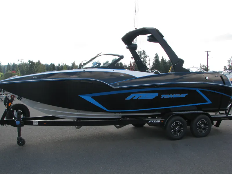 Slide: The Image of 2022 MB F22 Alpha boat interior with blue and gray seating, open bow design. - 3
