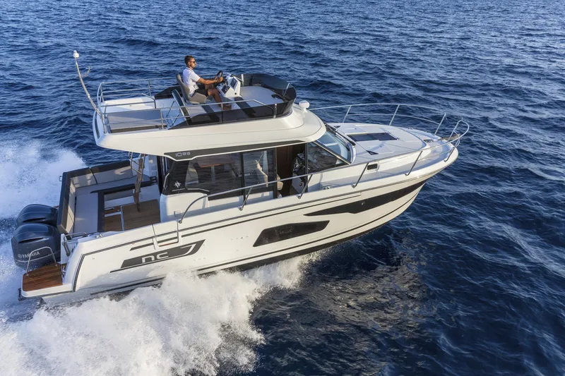 Slide: The Image of 2025 Jeanneau NC 1095 Fly cruising on open water, showcasing sleek design and performance. - 1