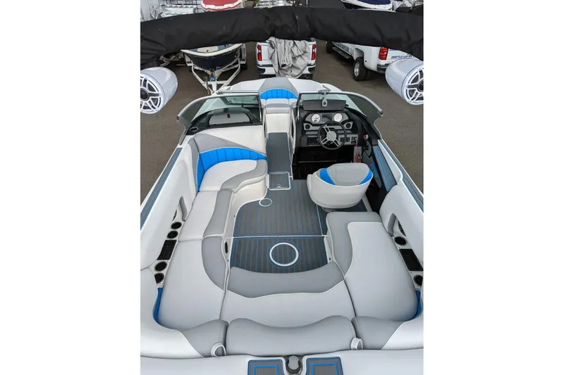 Slide: The Image of 2022 MB B52-21 Classic boat interior with modern seating and sleek dashboard design. - 12