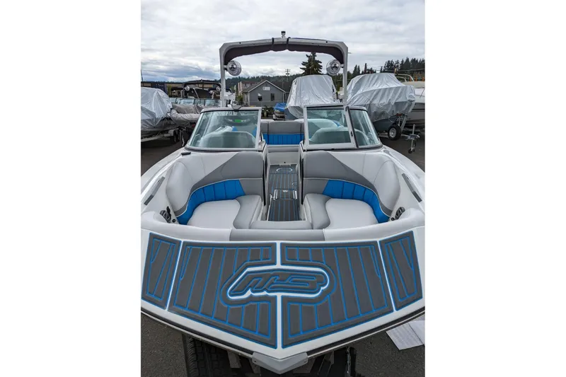 Slide: The Image of 2022 MB B52-21 Classic boat with blue and gray interior, docked outdoors. - 17