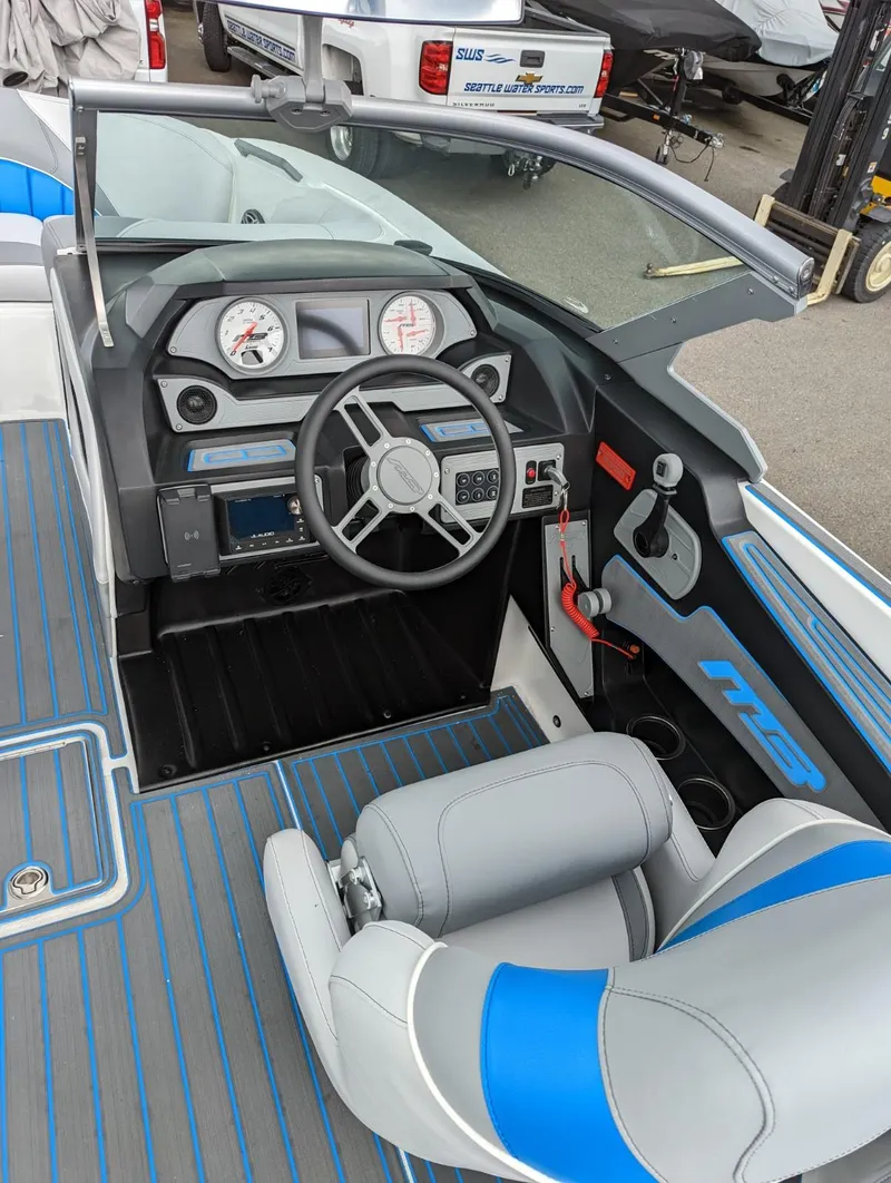 Slide: The Image of 2022 MB B52-21 Classic boat interior with steering wheel and dashboard. - 5