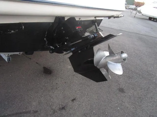 Slide: The Image of 2002 Bayliner 2655 Ciera Sunbridge boat propeller and stern drive on pavement. - 19