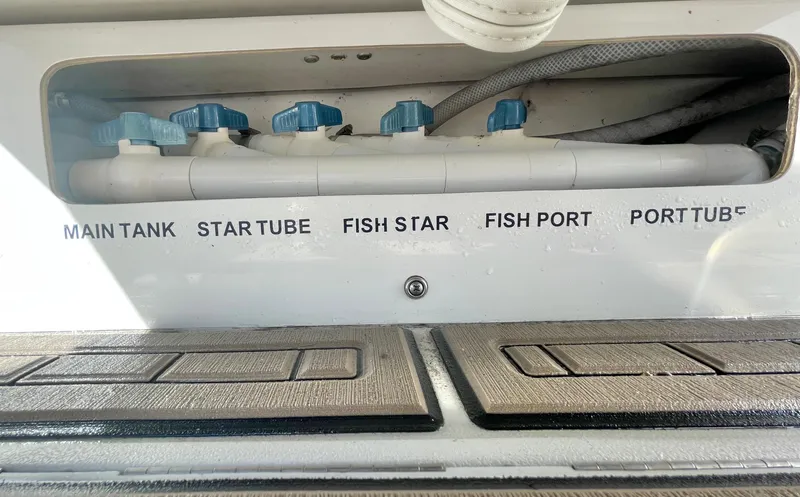 Slide: The Image of Control panel of a 2017 Parker 2320 Sport Cabin boat showing various tank and port labels. - 10