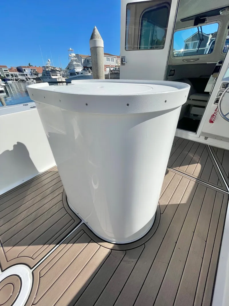 Slide: The Image of 2017 Parker 2320 Sport Cabin boat interior with white cylindrical structure. - 8