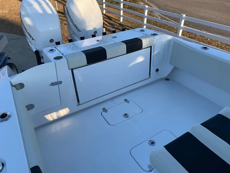 Slide: The Image of 2024 Cape Horn 32T boat interior with dual outboard engines. - 14
