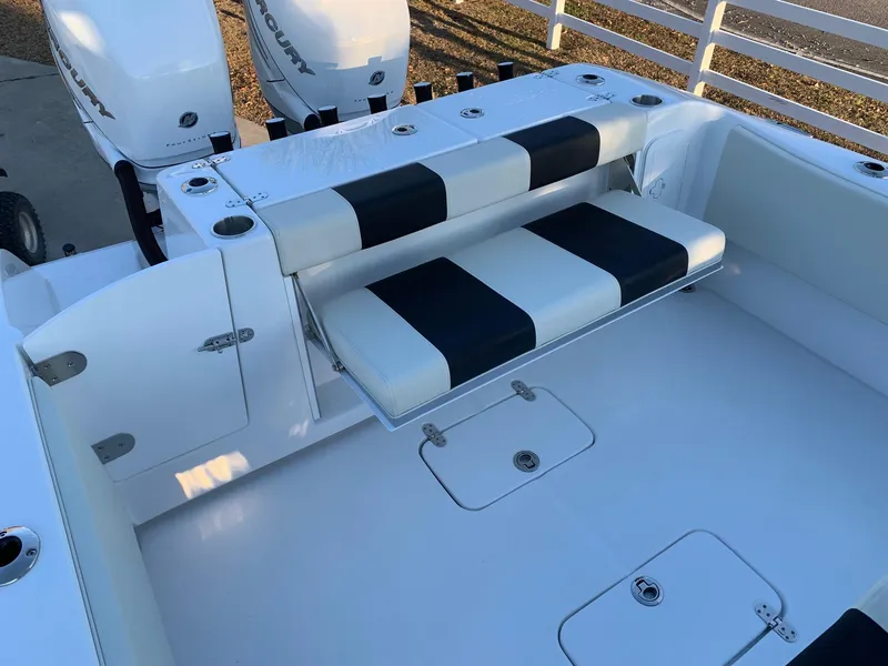 Slide: The Image of 2024 Cape Horn 32T boat with dual Mercury engines and cushioned seating. - 15