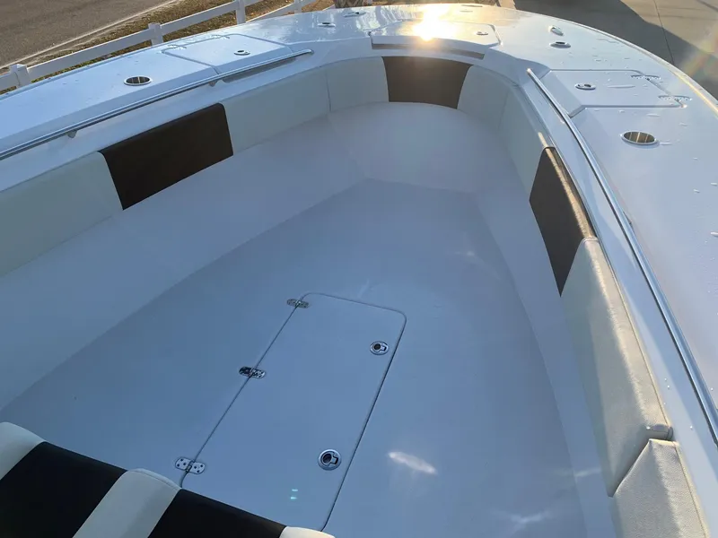 Slide: The Image of 2024 Cape Horn 32T boat interior with spacious seating and storage compartments. - 8