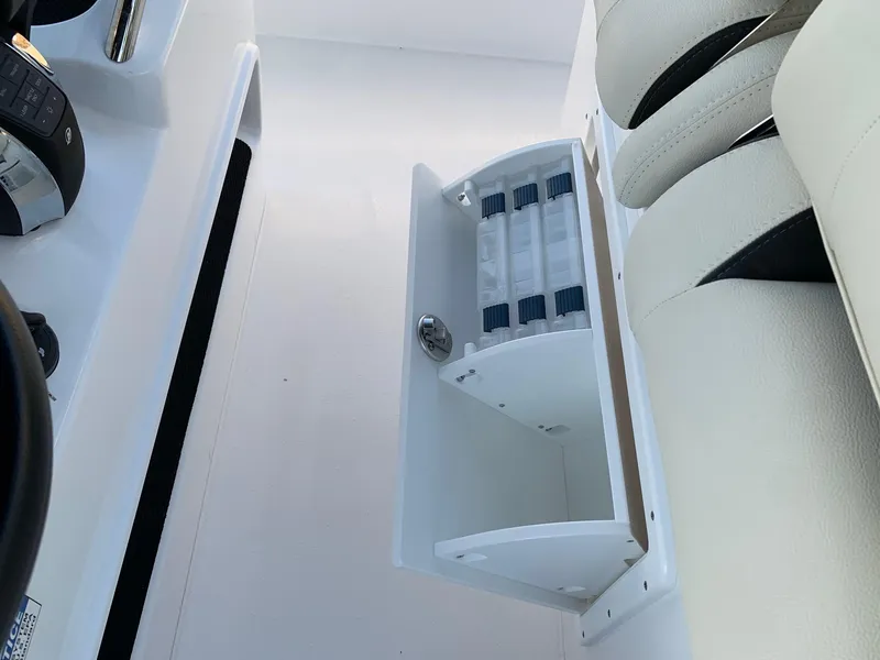 Slide: The Image of 2024 Cape Horn 32T boat storage compartment with white interior and seating. - 12
