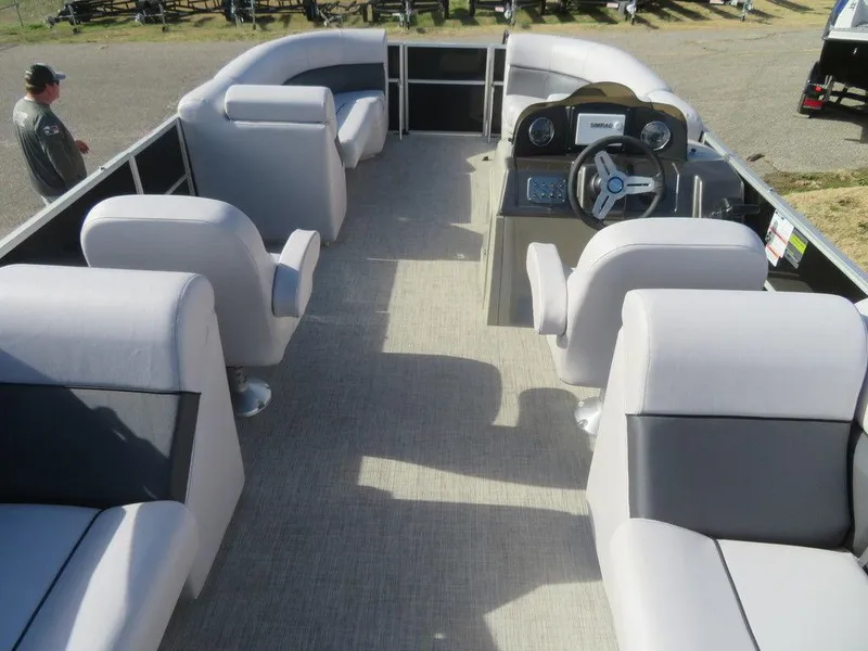 Slide: The Image of 2022 Coach Pontoons 241 RFC interior with spacious seating and modern helm. - 11