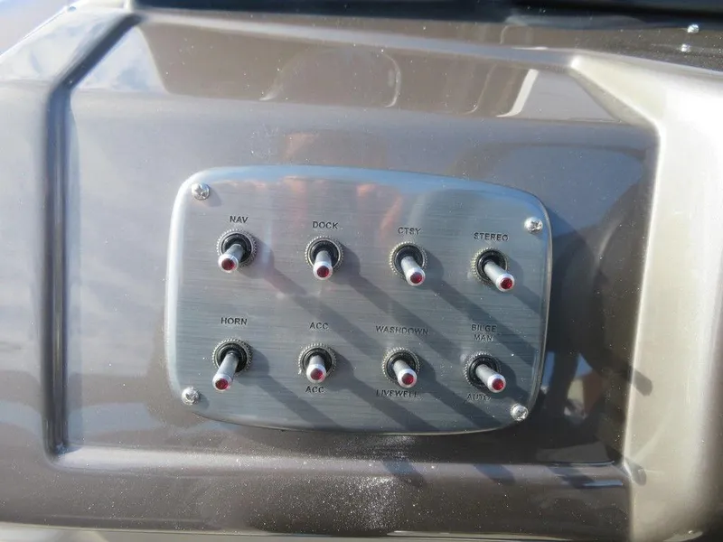 Slide: The Image of Control panel of a 2022 Coach Pontoons 241 RFC boat. - 14