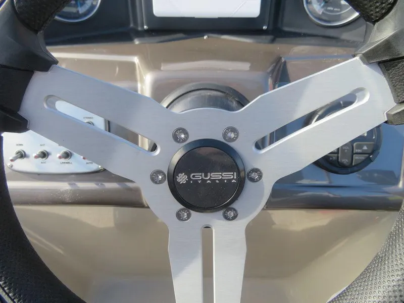Slide: The Image of Steering wheel of 2022 Coach Pontoons 241 RFC boat with Gussi Italia branding. - 15
