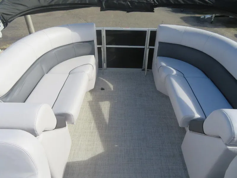 Slide: The Image of 2022 Coach Pontoons 241 RFC interior seating area with gray and white upholstery. - 17