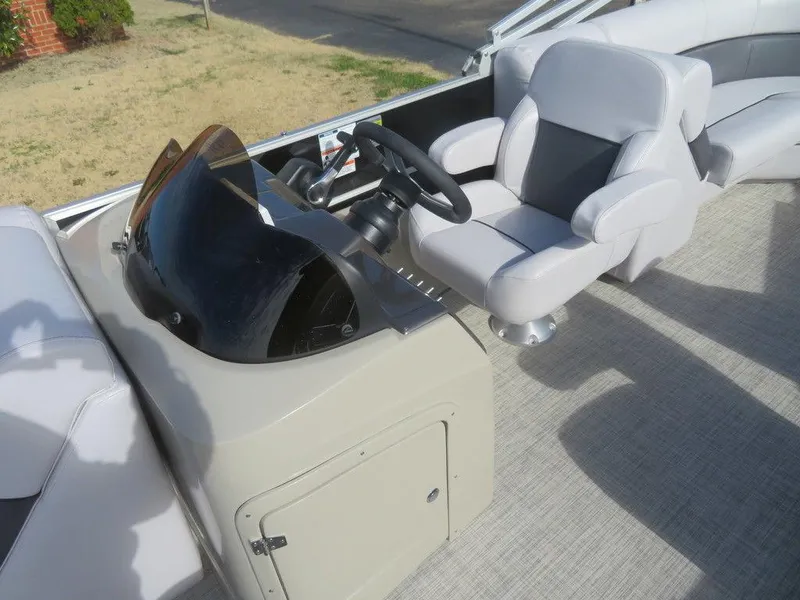 Slide: The Image of 2022 Coach Pontoons 241 RFC helm and captain's chair with modern design. - 23
