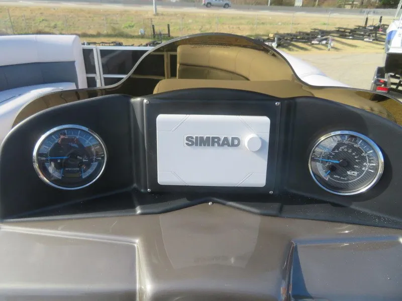 Slide: The Image of 2022 Coach Pontoons 241 RFC dashboard with Simrad display and gauges. - 26