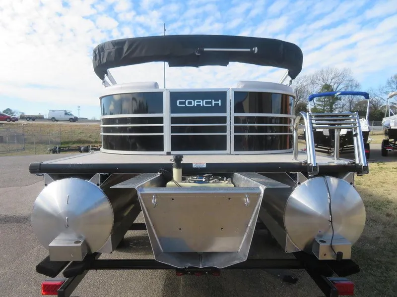 Slide: The Image of 2022 Coach Pontoons 241 RFC pontoon boat, rear view with black canopy and aluminum pontoons. - 3