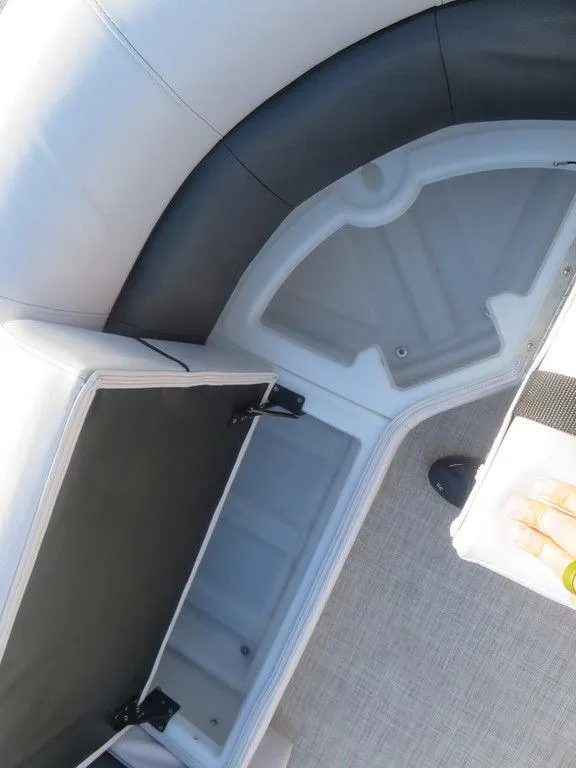 Slide: The Image of 2022 Coach Pontoons 241 RFC storage compartment with open seat. - 8
