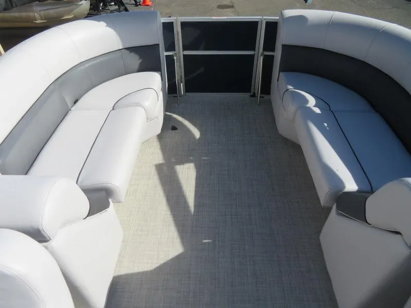 Slide: The Image of 2022 Coach Pontoons 241 RFC interior seating area with gray and white upholstery. - 12