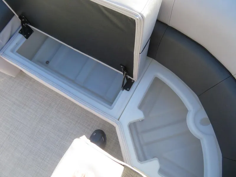 Slide: The Image of 2022 Coach Pontoons 241 RFC storage compartment with open seat cushion. - 15
