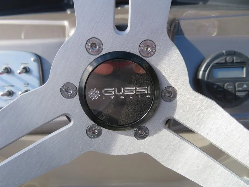 Slide: The Image of Close-up of 2022 Coach Pontoons 241 RFC steering wheel with Gussi Italia logo. - 23