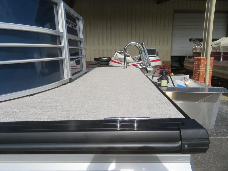 Slide: The Image of 2022 Coach Pontoons 241 RFC, rear deck view with ladder and cleat. - 5