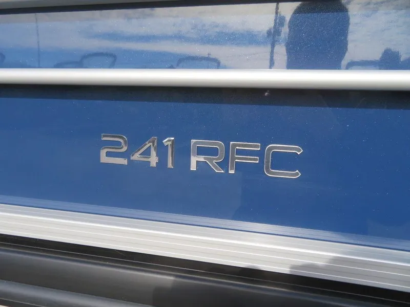 Slide: The Image of 2022 Coach Pontoons 241 RFC model nameplate on blue exterior. - 6