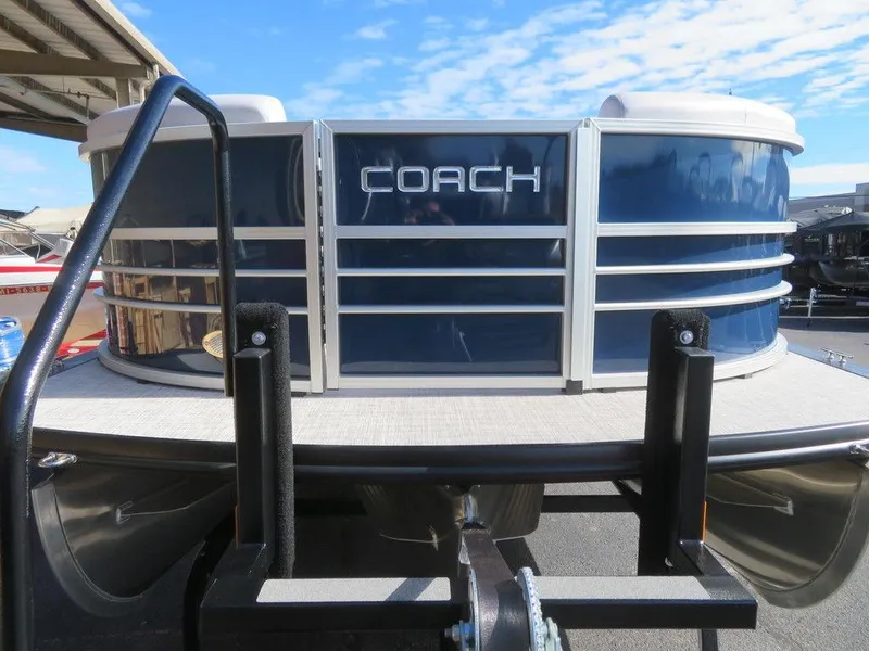 Slide: The Image of 2022 Coach Pontoons 241 RFC front view with blue and silver design. - 9
