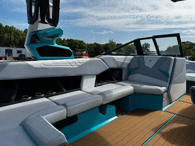 Slide: The Image of 2022 Nautique S23 boat interior with modern seating and sleek design. - 15