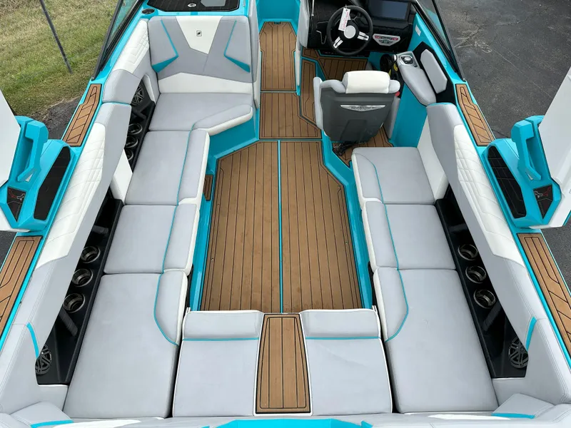 Slide: The Image of 2022 Nautique S23 boat interior with spacious seating and modern design. - 5