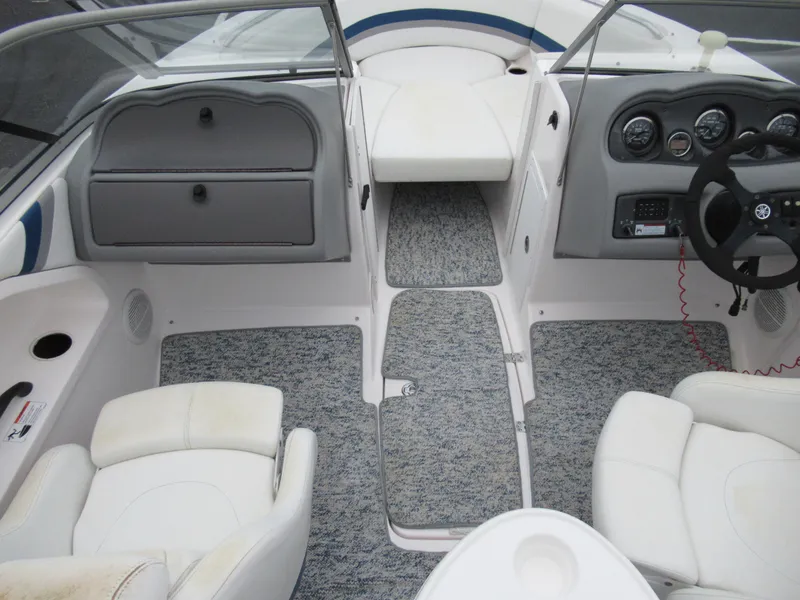 Slide: The Image of 2004 Yamaha Boats SX230 interior cockpit with seating and dashboard. - 10