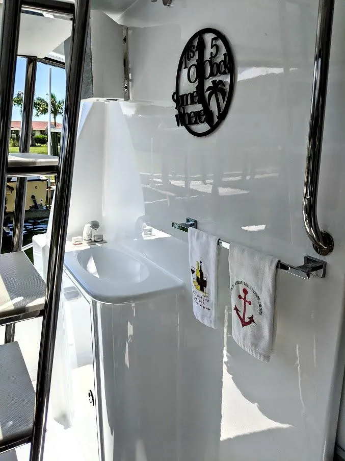 Slide: The Image of Interior of Jutson 46 LRC yacht, 2000, featuring sink and towels. - 13