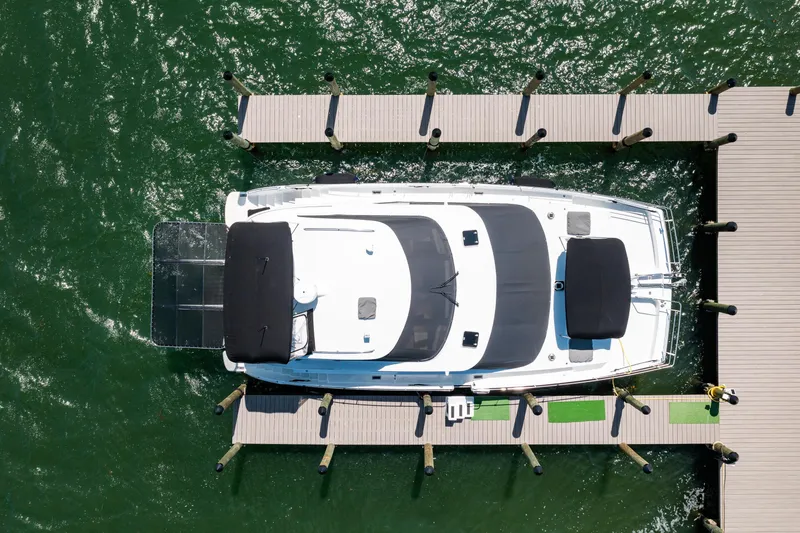Slide: The Image of Overhead view of 2000 Jutson 46 LRC yacht docked in marina. - 2