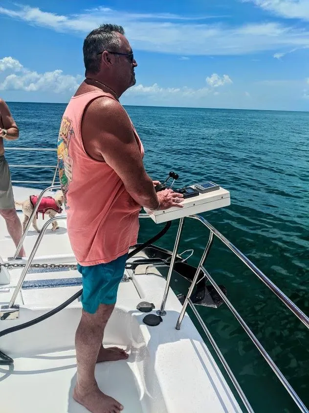 Slide: The Image of Man steering Jutson 46 LRC yacht on open sea. - 28