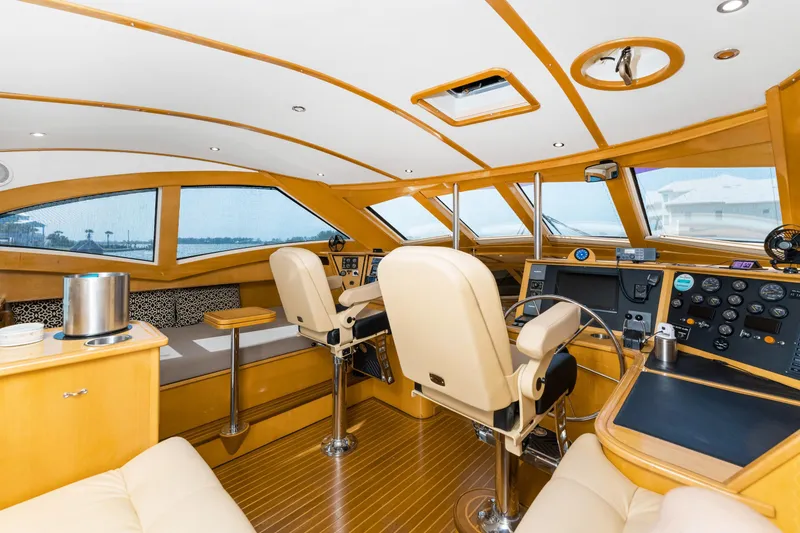 Slide: The Image of Luxurious interior of 2000 Jutson 46 LRC yacht with modern helm and seating. - 29